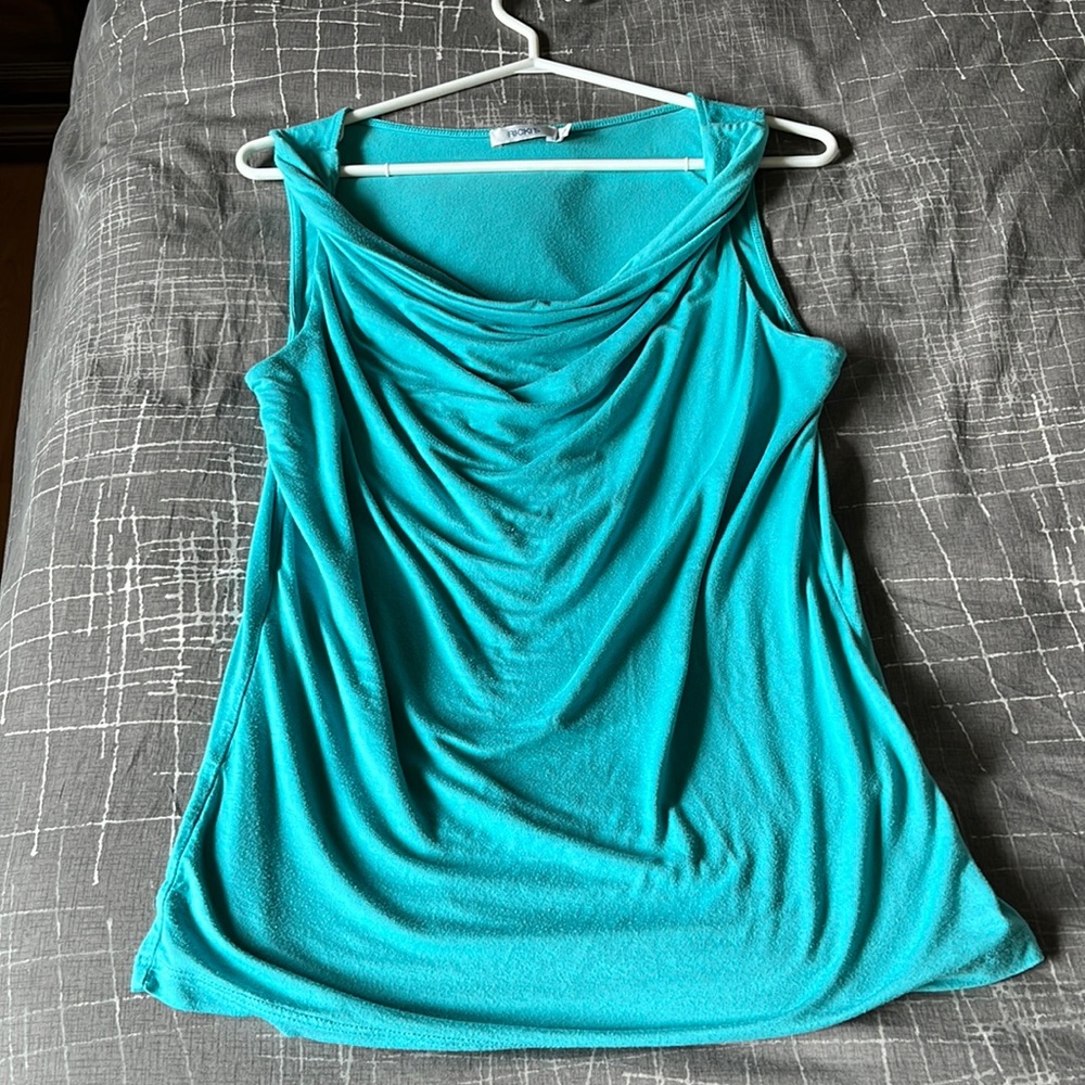 Ricki’s blue sleeveless top